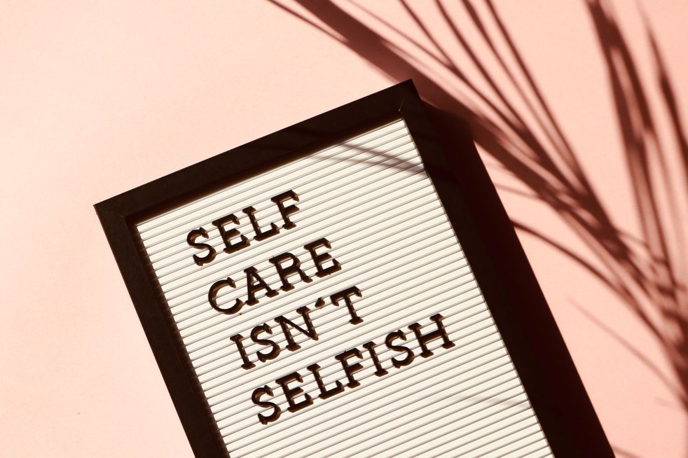 Letter board reading 'Self care isn't selfish'